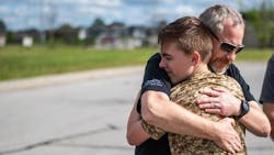 Joplin, MO, Police Officer Rick Hirshey, who was shot in the face in a March shooting that left two officers dead, hugs Zechariah of Running 4 Heroes Inc. during an event in May. Joplin, MO, Police Officer Rick Hirshey, who was shot in the face in a March shooting that left two officers dead, hugs Zechariah of Running 4 Heroes Inc. during an event in May.