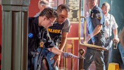 Connor Hayhurst, a teen born with a rare heart defect, works with Schenectady, NY, police officers to solve a fictional stolen artwork case at Union College on Tuesday thanks to the Make-a-Wish Foundation. Connor Hayhurst, a teen born with a rare heart defect, works with Schenectady, NY, police officers to solve a fictional stolen artwork case at Union College on Tuesday thanks to the Make-a-Wish Foundation.