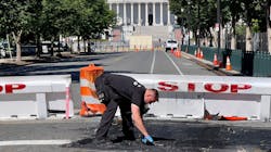 A U.S. Capitol police officer works near a barricade on Capitol Hill in Washington, D.C., on Sunday. A man died near the Capitol building after driving his car into a barricade and firing shots into the air before turning his gun on himself, police said. A U.S. Capitol police officer works near a barricade on Capitol Hill in Washington, D.C., on Sunday. A man died near the Capitol building after driving his car into a barricade and firing shots into the air before turning his gun on himself, police said.