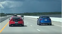 Two street racers on a Santa Rosa Beach, FL, bridge were caught in the act Wednesday after they revved up in front of the Walton County Sheriff's Office's chief of operations.
