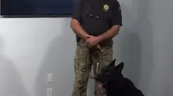 Hammer, a Richland County, SC, Sheriff's Department K-9, and his trainer and handler, Michel Galliot, attend a press conference Monday announcing the addition of new dogs to the agency.