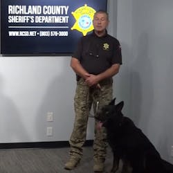 Hammer, a Richland County, SC, Sheriff&apos;s Department K-9, and his trainer and handler, Michel Galliot, attend a press conference Monday announcing the addition of new dogs to the agency.
