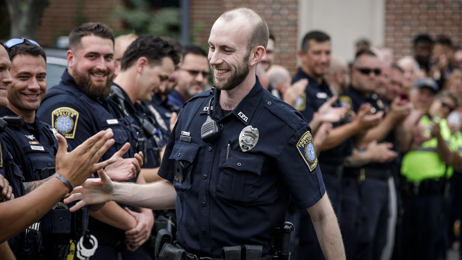 Farmington, CT, Police Officer James O'Donnell returned to work Monday, almost exactly a year after he was caught between a stolen car and a cruiser during a call, crushing his lower body in the process.