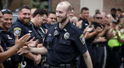 Farmington, CT, Police Officer James O'Donnell returned to work Monday, almost exactly a year after he was caught between a stolen car and a cruiser during a call, crushing his lower body in the process.
