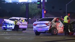 A Glendale, AZ, police officer and two other people were injured when they were involved in a crash between a police SUV and another vehicle early Tuesday. A Glendale, AZ, police officer and two other people were injured when they were involved in a crash between a police SUV and another vehicle early Tuesday.
