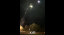 A Las Vegas police helicopter rescues two people trapped in a van caught in fast-moving floodwaters near Mopa early Wednesday.