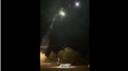A Las Vegas police helicopter rescues two people trapped in a van caught in fast-moving floodwaters near Mopa early Wednesday.