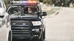 An officer with the Melbourne Police Department is seen inside his patrol car working on a TOUGHBOOK laptop.