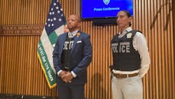 NYPD detectives show off new lighter bullet-resistant vests that can be worn under suit jackets during a press conference Wednesday.