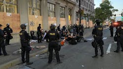 Oakland, CA, police officers detain demonstrators following a protest in June 2020. Oakland, CA, police officers detain demonstrators following a protest in June 2020.