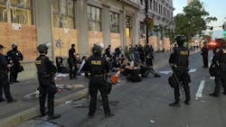 Oakland, CA, police officers detain demonstrators following a protest in June 2020.