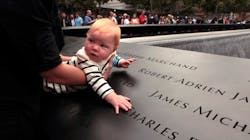 Julie Jalbert-Pitt (not pictured), who lost her father Robert Jalbert on 9/11, holds her 8-month-old daugher, Campbell Pitt, next to the name of her father on the 9/11 Memorial during the 10th anniversary ceremonies at the World Trade Center site in New York City on Sept. 11, 2011. Julie Jalbert-Pitt (not pictured), who lost her father Robert Jalbert on 9/11, holds her 8-month-old daugher, Campbell Pitt, next to the name of her father on the 9/11 Memorial during the 10th anniversary ceremonies at the World Trade Center site in New York City on Sept. 11, 2011.