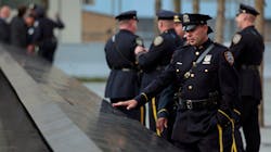 Police officers approach the south pool monument before tenth anniversary ceremonies at the site of the World Trade Center in New York City on Sept. 11, 2011. Police officers approach the south pool monument before tenth anniversary ceremonies at the site of the World Trade Center in New York City on Sept. 11, 2011.