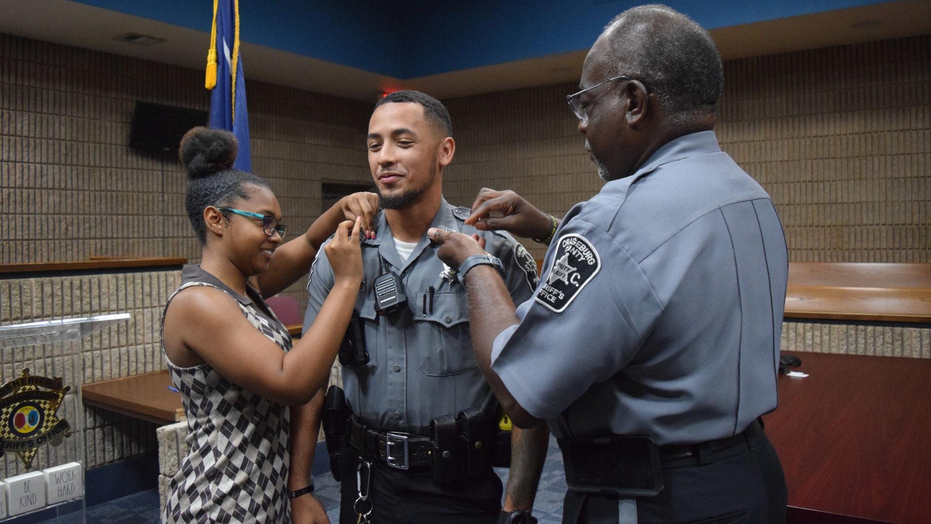 Sheron Knight receives his corporal insignia during a promotion ceremony for the Oragneburg County, SC, Sheriff's Department last month.