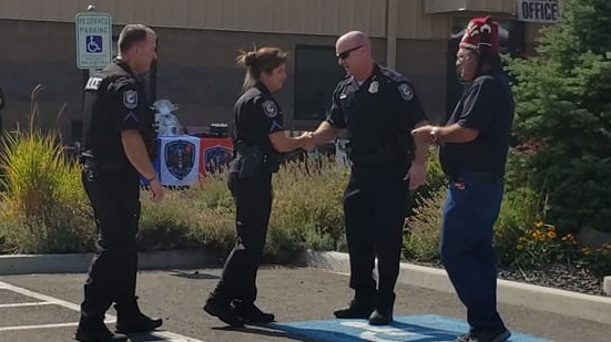 Spokane, WA, Police Officers Kris Honaker and Michele Kernkamp are awarded the El Katif Shriners Officer of the Year awards during a ceremony Saturday.