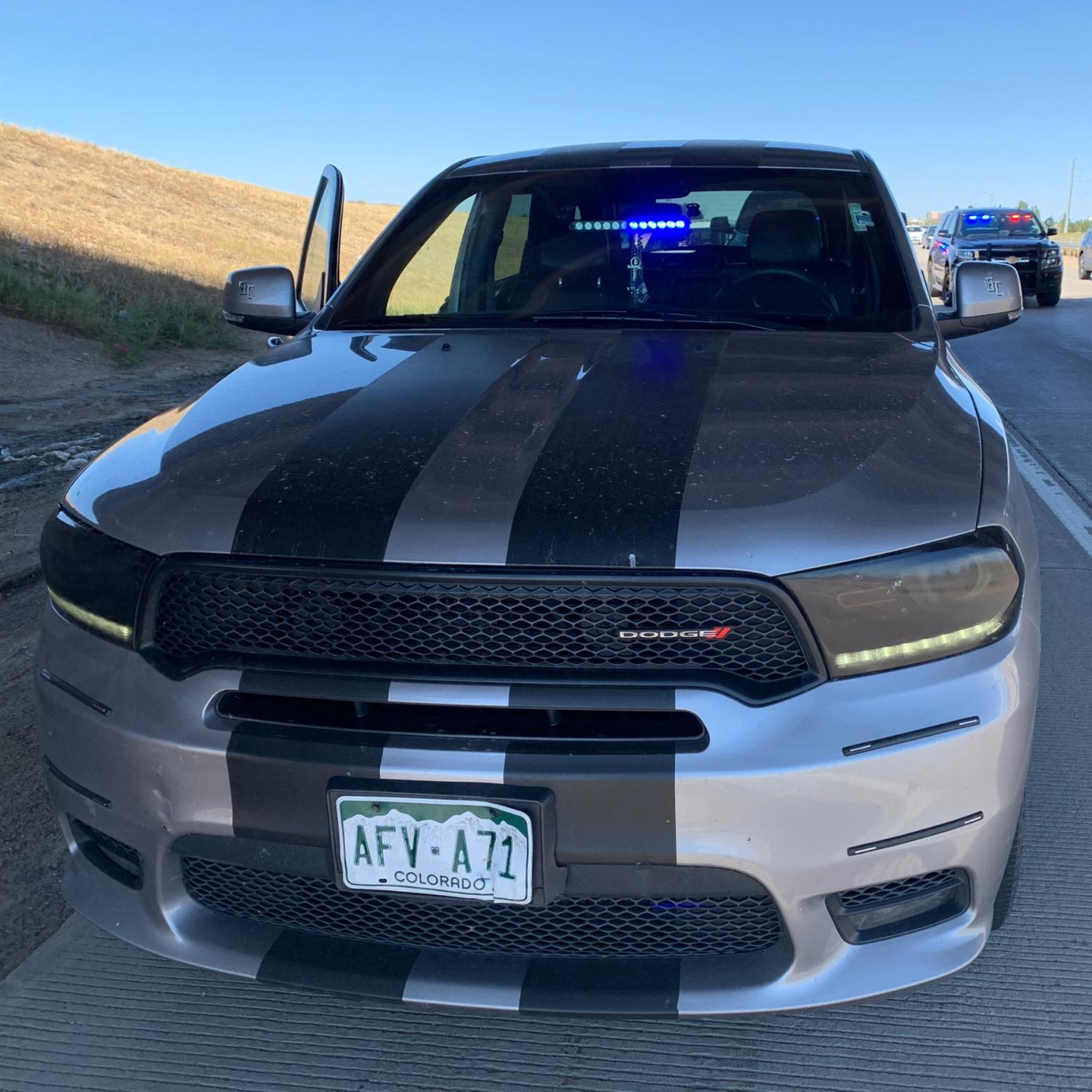 An off-duty law enforcement officer was pulled over in Brighton, CO, on Saturday by a phony police officer in an unmarked car with flashing blue lights.