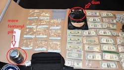 A Bellingham, WA, police officer spotted a wanted felon while on night patrol Wednesday, and that arrest uncovered cash, a pistol and over 2,000 fentanyl pills and other drugs.