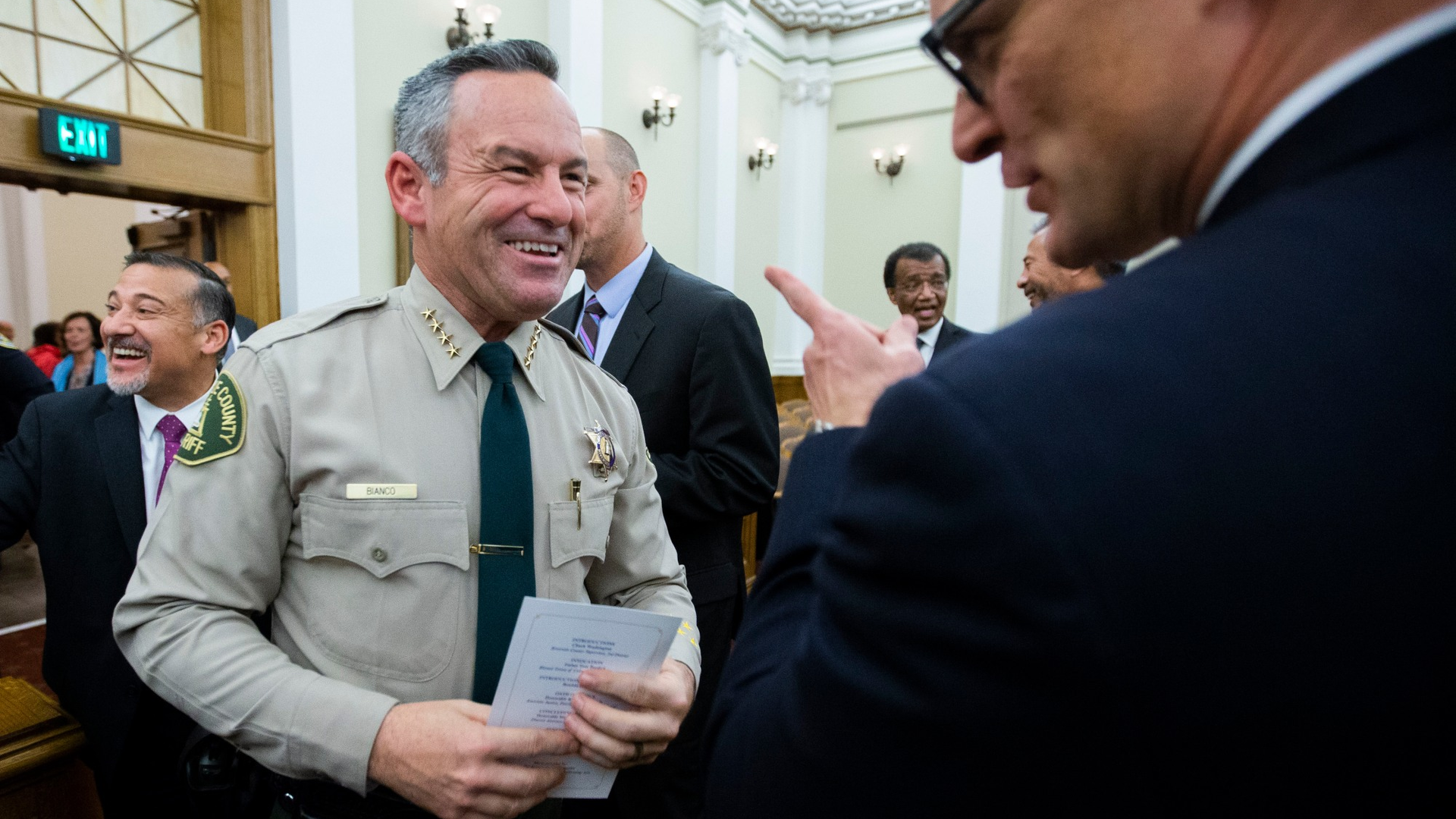 Riverside County, CA, Sheriff Chad Bianco greets Riverside County District Attorney Mike Hestrin after he took the oath of office for his second term in 2019.