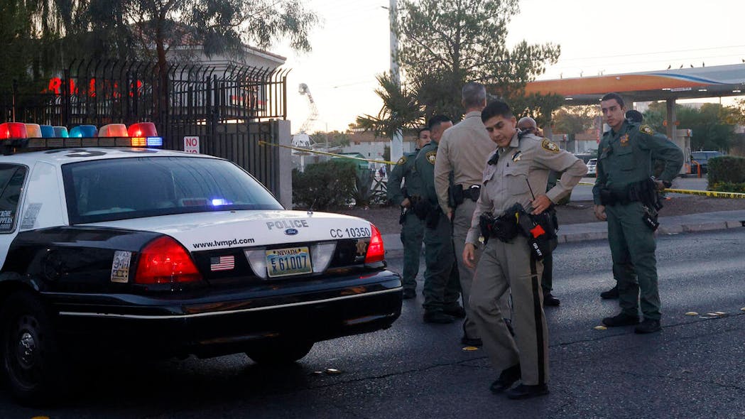 Las Vegas police investigate a shooting Thursday that left an officer dead.