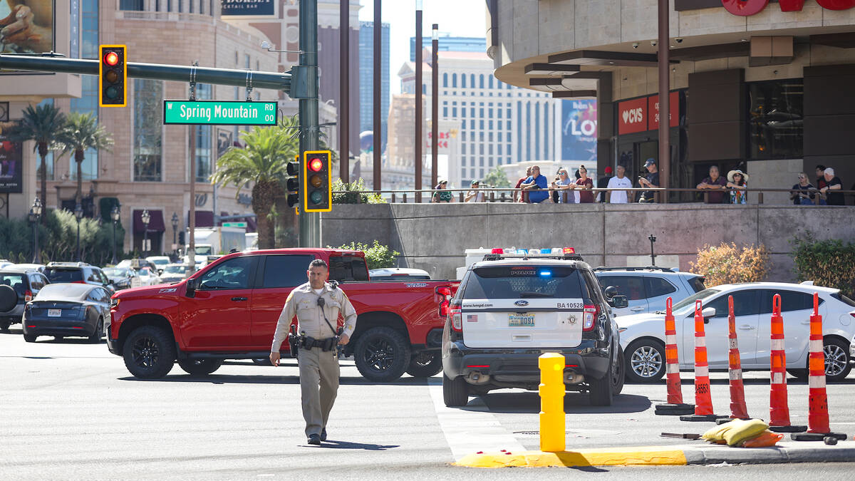 Police at the scene where multiple people were stabbed in front of a Strip casino in Las Vegas on Thursday.
