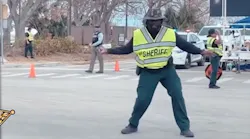 Lee County, FL, Sheriff's Deputy Carl Elie dances as he directs traffic in Fort Myers Beach, which was hit hard by Hurricane Ian.