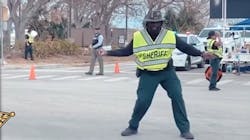 Lee County, FL, Sheriff's Deputy Carl Elie dances as he directs traffic in Fort Myers Beach, which was hit hard by Hurricane Ian. Lee County, FL, Sheriff's Deputy Carl Elie dances as he directs traffic in Fort Myers Beach, which was hit hard by Hurricane Ian.