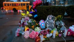 A photo of Alexandria Bell, 15, rests at the scene of a growing floral memorial to the victims of Monday's school shooting at Central Visual & Performing Arts High School. Bell and teacher Jean Kuczka were killed, along with gunman Orlando Harris. A photo of Alexandria Bell, 15, rests at the scene of a growing floral memorial to the victims of Monday's school shooting at Central Visual & Performing Arts High School. Bell and teacher Jean Kuczka were killed, along with gunman Orlando Harris.