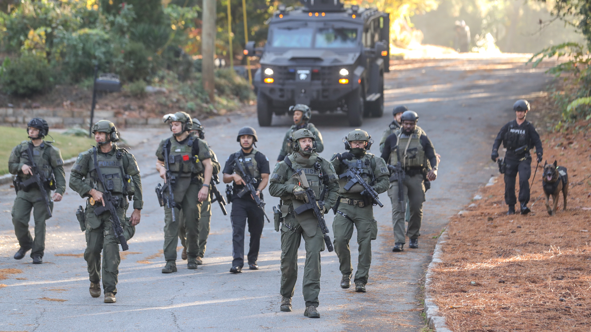 A search for a suspect accused of shooting a Chamblee, GA, police officer closed roads Tuesday morning in a residential area near Northlake Mall.