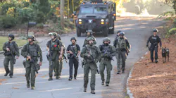 A search for a suspect accused of shooting a Chamblee, GA, police officer closed roads Tuesday morning in a residential area near Northlake Mall.