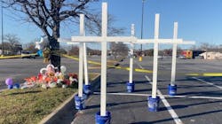 Former Chesapeake, VA, police officer Matt Cilento placed six crosses at a memorial for the victims of a Tuesday shooting at a Walmart that left seven people dead, including the shooter, a store manager. Former Chesapeake, VA, police officer Matt Cilento placed six crosses at a memorial for the victims of a Tuesday shooting at a Walmart that left seven people dead, including the shooter, a store manager.