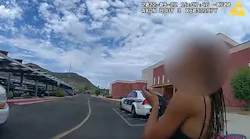A Phoenix school resource officer disarms a woman who brandished a gun during an on-campus domestic dispute in September.