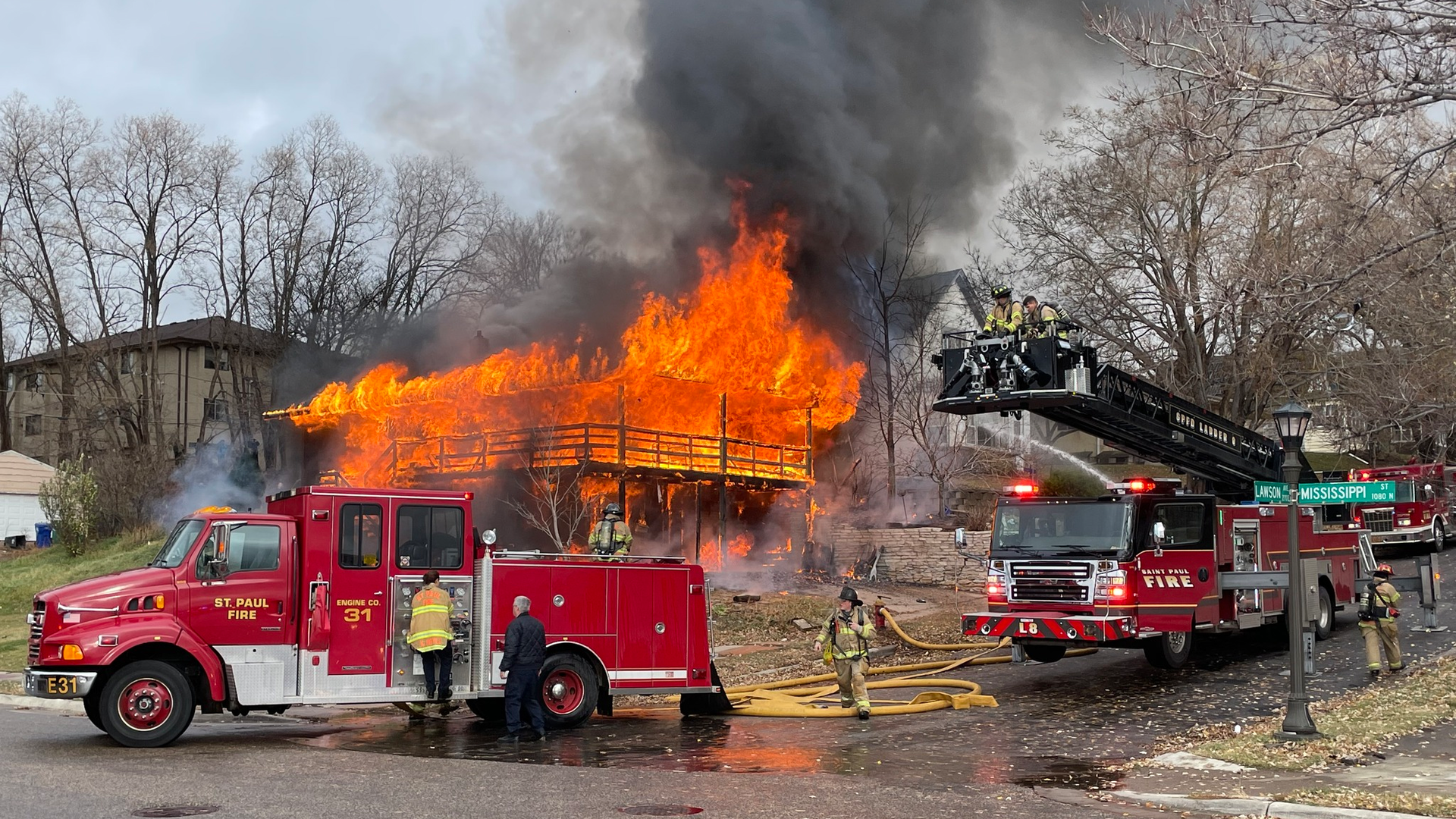 St. Paul, MN, police officers rescued a person and a dog from a two-story house fire Thursday.