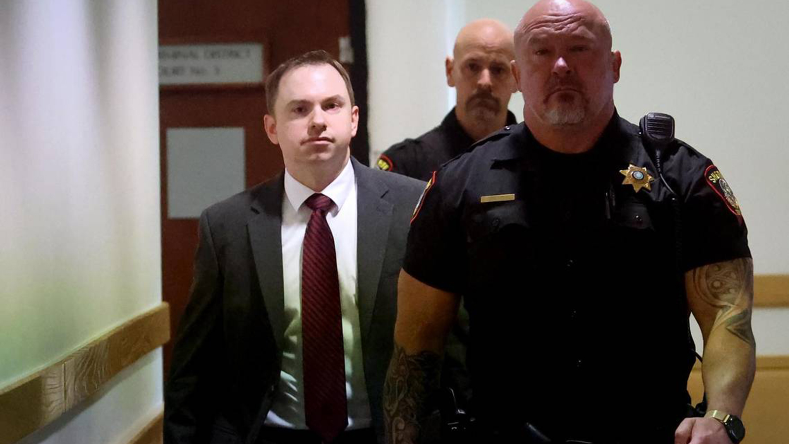 Former Fort Worth, TX, Police Officer Aaron Dean (left) enters Tarrant County&rsquo;s 396th District Court on Thursday.