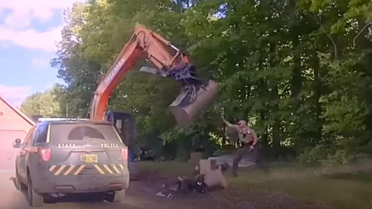 Vermont State Police troopers were trying to take a man into custody in Hardwick in June when his father got behind the controls of an excavator to swing the scoop at troopers in a wild attack.