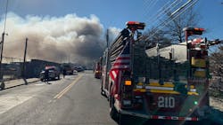 Firefighters battled a massive three-alarm fire that broke out at an NYPD auto impound yard in Brooklyn on Tuesday. Firefighters battled a massive three-alarm fire that broke out at an NYPD auto impound yard in Brooklyn on Tuesday.