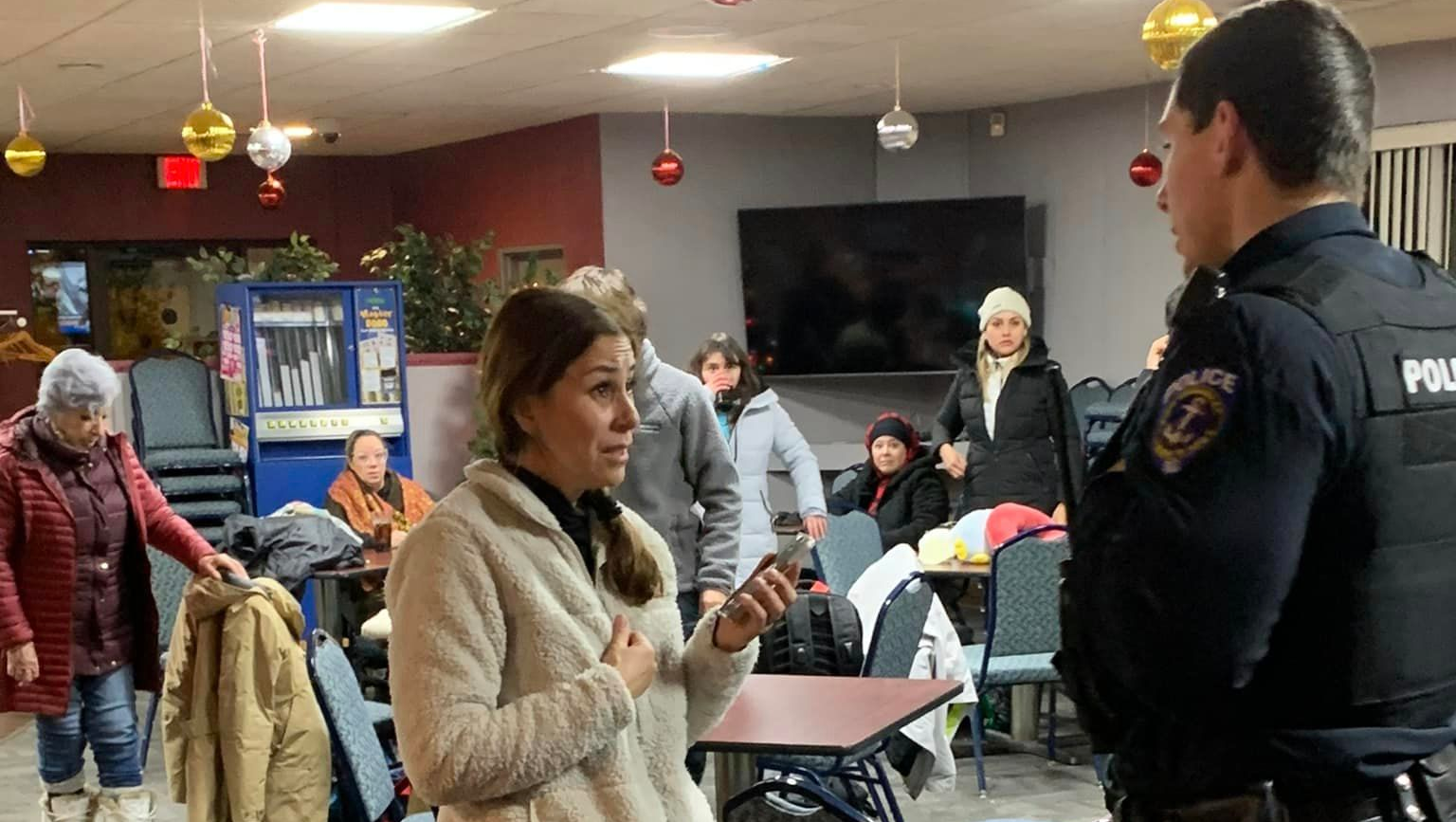 Two North Tonawanda, NY, police officers led 60 tourists to the city's fire hall after their bus headed to Washington, D.C., ran off the road and became wedged in a snow bank Saturday.