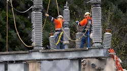 A Tacoma Power crew works at an electrical substation damaged by vandals early Christmas morning in Graham, WA, which caused power outages.