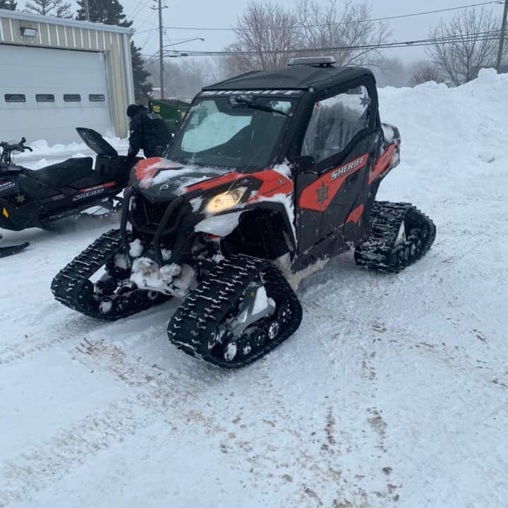 Erie County, NY, sheriff's deputies used a tracked utility terrain vehicle to rescue a man and his 3-year-old son trapped in their car during the blizzard Saturday.