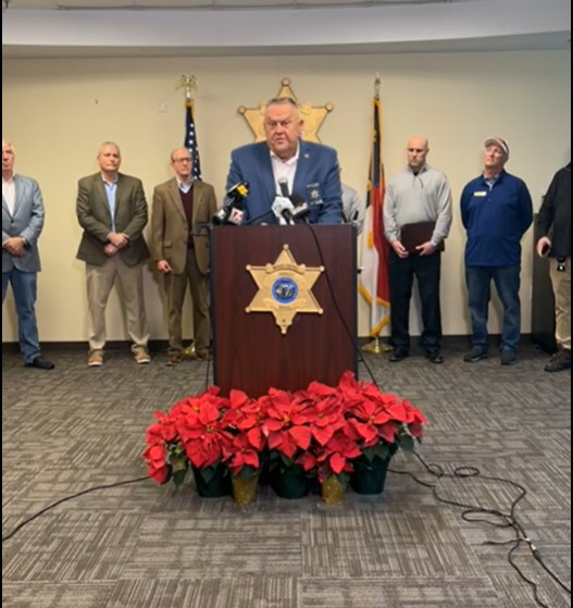 Moore County, NC, Sheriff Ronnie Fields talks to reporters Thursday concerning search warrants in connection with shootings at two electrical substations that knocked out power for days.