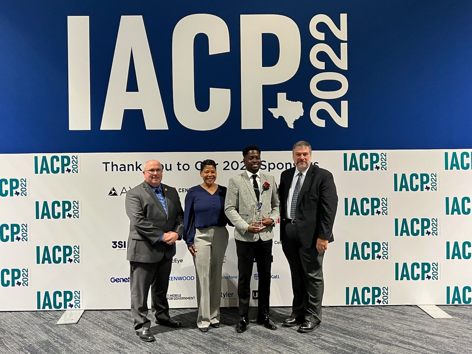 From left to right: Julio Valcarcel, Vice President of Sales, Leonardo; Chief Mirtha V. Ramos, Chief of Police, DeKalb County Police Department; Officer Deandre T. Brown; Chris McDonold, Chair of the Vehicle Crimes Committee and Executive Director of the Maryland vehicle Theft Prevention Council.
