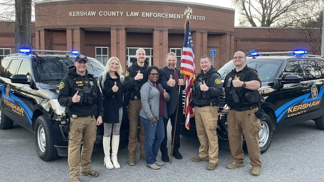 Former wrestler 'Hacksaw' Jim Duggan (center) met with and thanked the dispatcher and deputies who helped him with a home intruder in December.