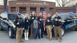 Former wrestler 'Hacksaw' Jim Duggan (center) met with and thanked the dispatcher and deputies who helped him with a home intruder in December. Former wrestler 'Hacksaw' Jim Duggan (center) met with and thanked the dispatcher and deputies who helped him with a home intruder in December.