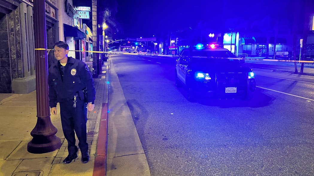 Police investigate the scene of a mass shooting at a Monterey Park, CA, dance studio Saturday that left 10 dead and 10 wounded.