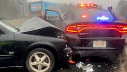 Two New Hampshire State Police troopers were injured when an out-of-control vehicle struck a cruiser while they were helping a motorist in the breakdown lane along the interstate in Bow on Tuesday. Two New Hampshire State Police troopers were injured when an out-of-control vehicle struck a cruiser while they were helping a motorist in the breakdown lane along the interstate in Bow on Tuesday.