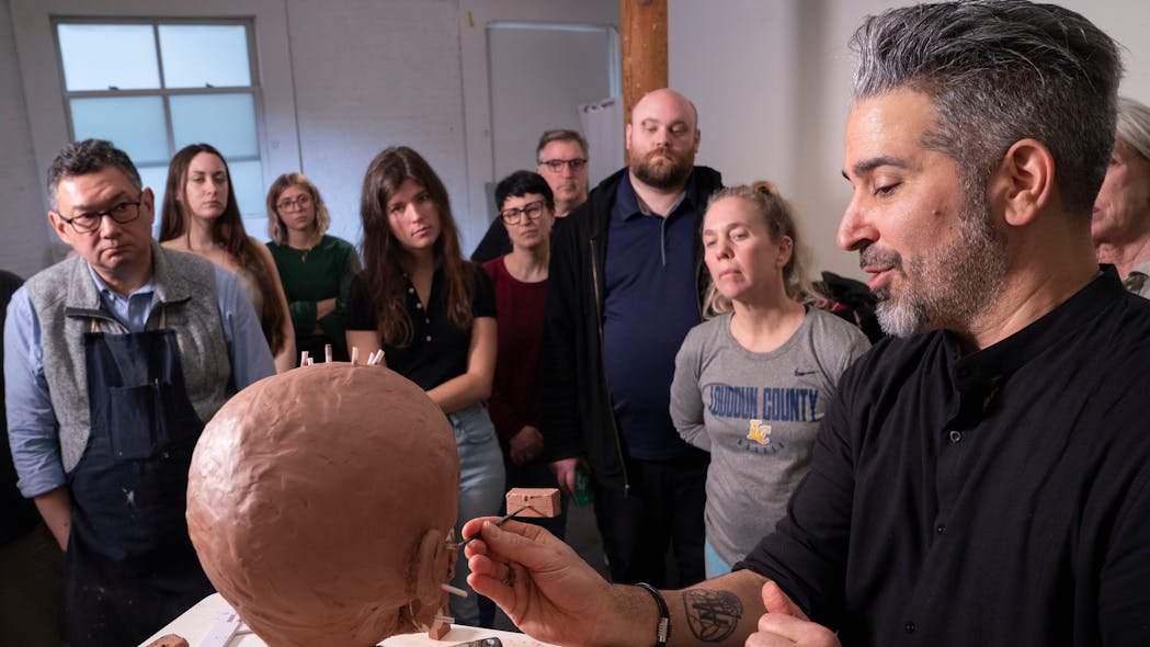 National Center for Missing and Exploited Children senior forensic imaging specialist Joe Mullins explains how to reconstruct lips during a facial reconstruction class at the New York Academy of Art.