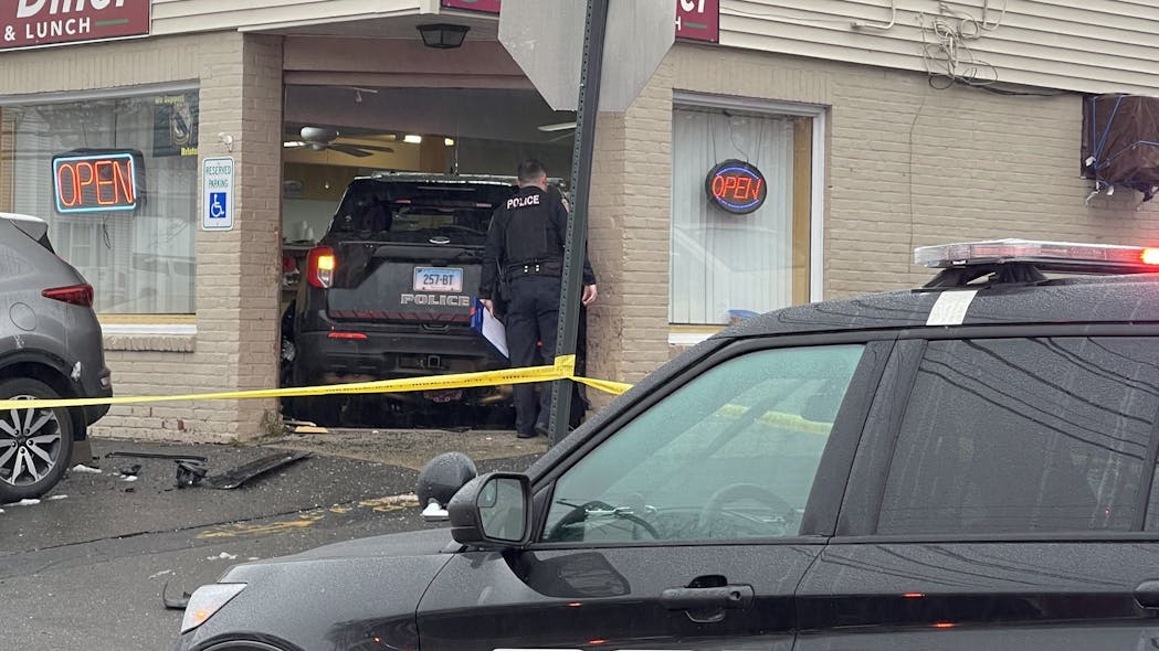 A stolen Bristol, CT, police cruiser was driven into a diner following a chase Thursday.