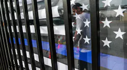 Small memorials, including a Thin Blue Line flag, remain days after dozens of Los Angeles County Sheriff recruits on a training run were struck by a man driving an SUV on Nov. 2 in Whittier.