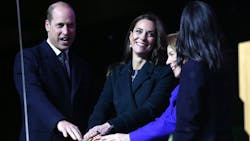 Prince William (from left) and Kate Middleton, Princess of Wales, join Massachusetts Governor-elect Maura Healey and Boston Mayor Michelle Wu in pushing a button to illuminate buildings in Boston in green light Nov. 30.