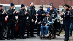 NYPD Officer Paul Lee is wheeled by his partner Antonio Martinez during his release from St. Barnabas Hospital in the Bronx on Tuesday. NYPD Officer Paul Lee is wheeled by his partner Antonio Martinez during his release from St. Barnabas Hospital in the Bronx on Tuesday.