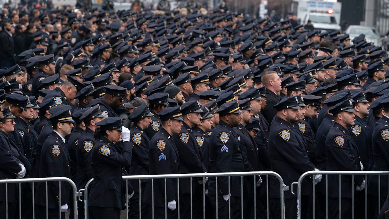 NYPD officers line up for the funeral of NYPD officer Adeed Fayaz at the Makki Masjid Muslim Community Center on Thursday in Brooklyn. NYPD officers line up for the funeral of NYPD officer Adeed Fayaz at the Makki Masjid Muslim Community Center on Thursday in Brooklyn.